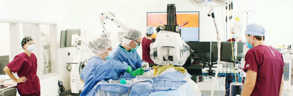Surgical team with the Neuralink robot in an operating room