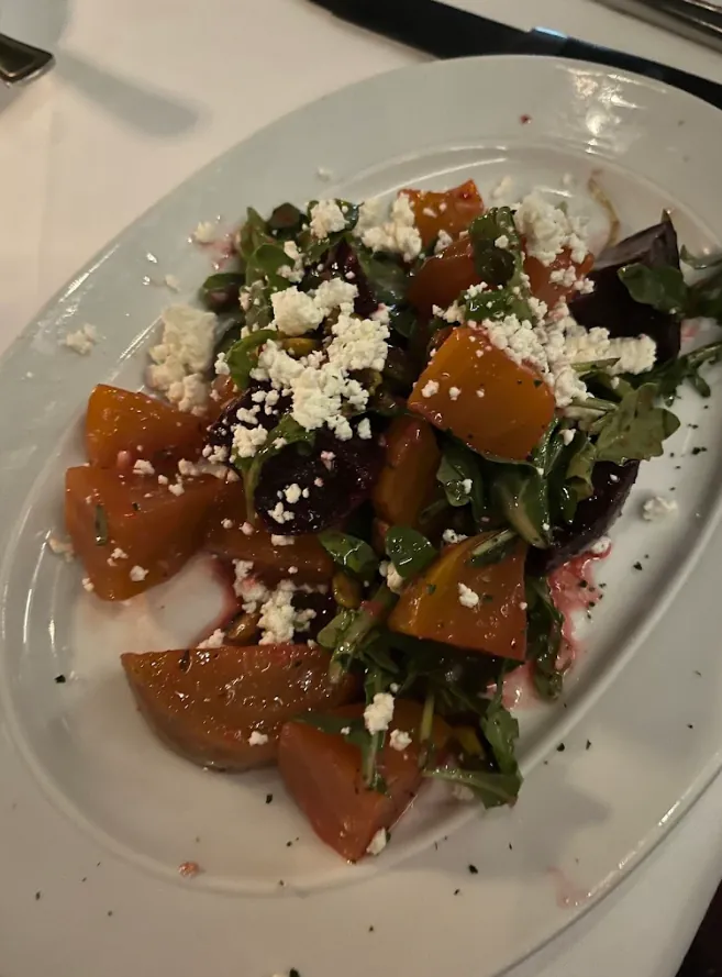 Plain phone photo of a beet and feta salad